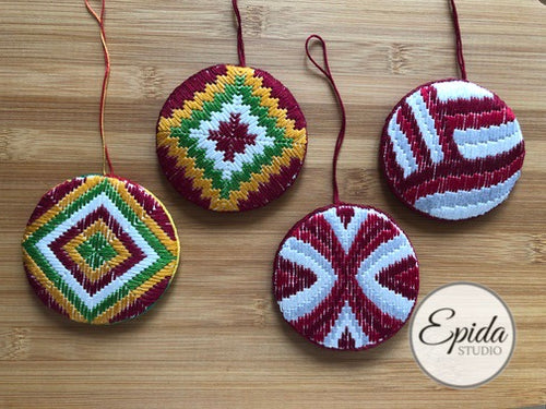 four bargello Christmas ornaments.
