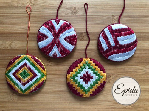 four bargello Christmas ornaments.