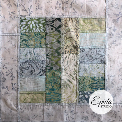 batik block with light fabric border.