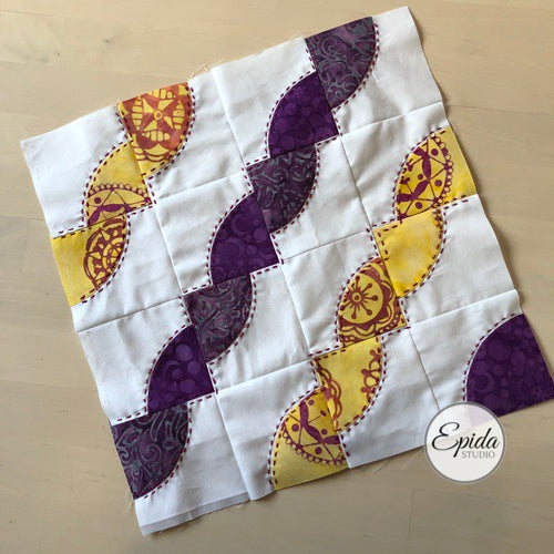 drunkards path quilt block with embroidery.