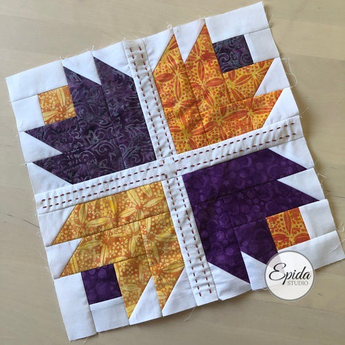 cactus rose quilt block embellished with hand embroidery.