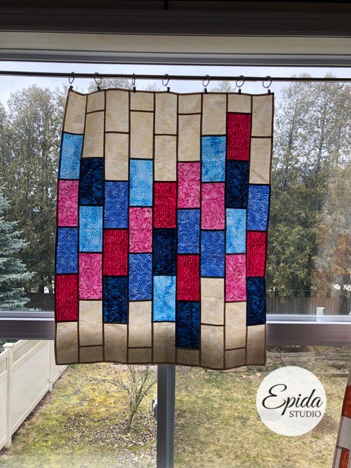 blue and pink Bright Bricks window hanging.
