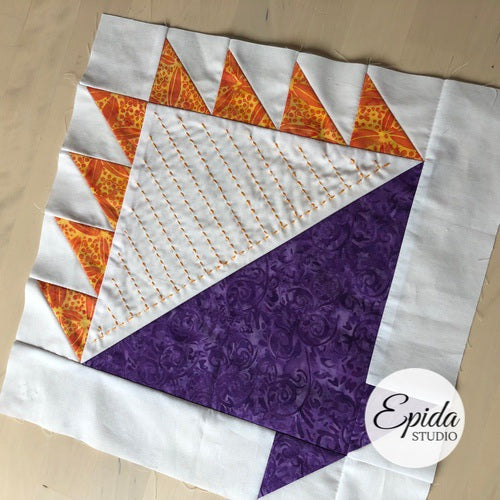 Quilt block made with triangles.