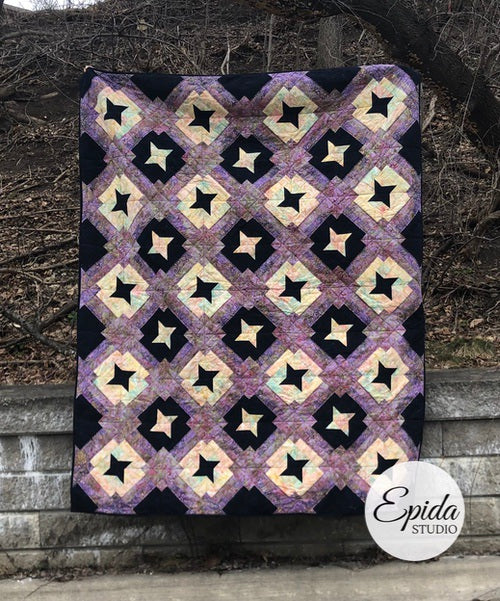 Friendship Trails quilt pattern made with blue and purple batik fabric.