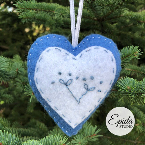 felt Christmas ornament with hand embroidery.