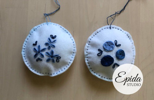 white and blue felt Christmas ornaments.