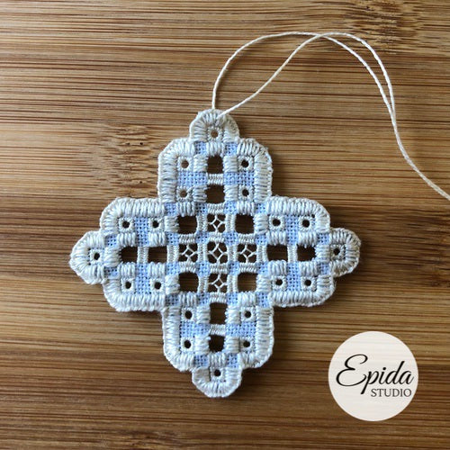 hardanger embroidery on blue linen.