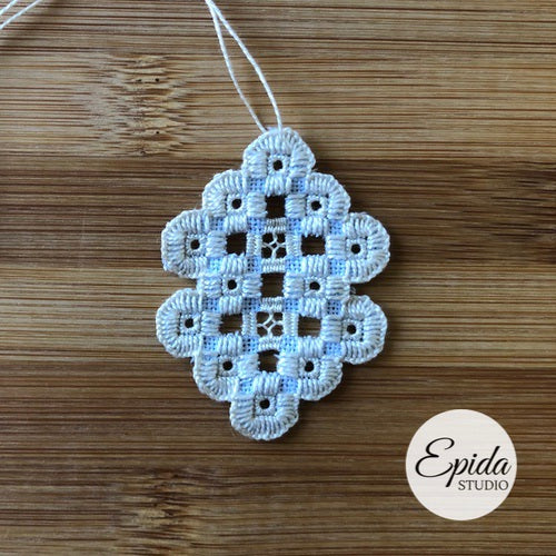hand embroidered Christmas ornament.
