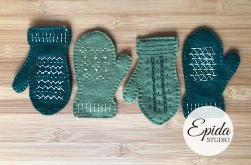 four green felt mitten ornaments.