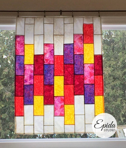 pink and yellow Bright Bricks window hanging.