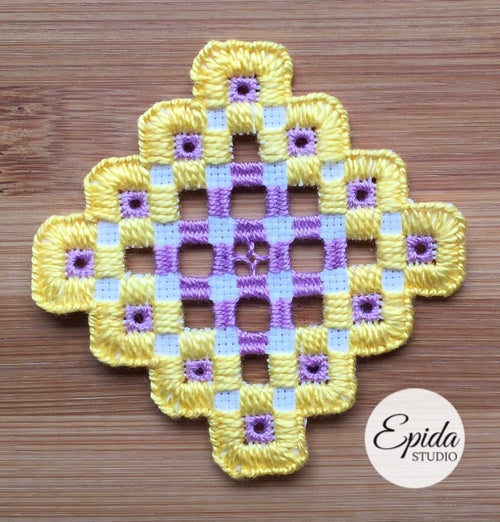 purple and yellow hardanger motif.