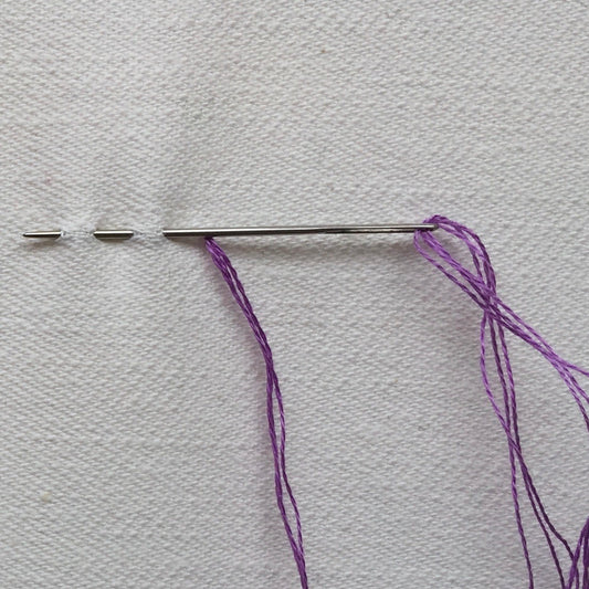 running stitch in progress.