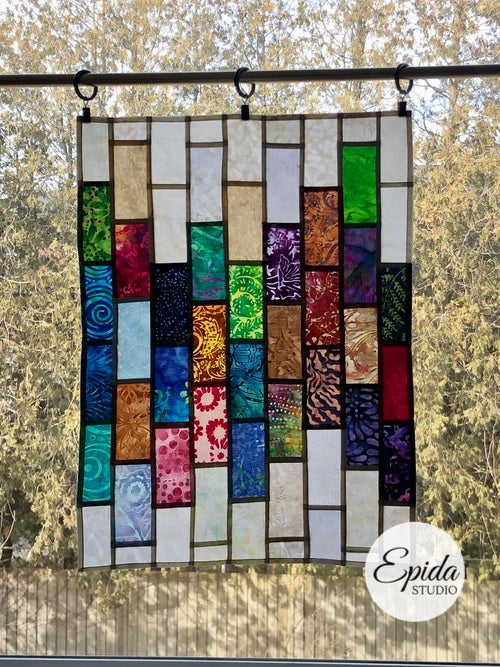 Scrappy stained glass window hanging.
