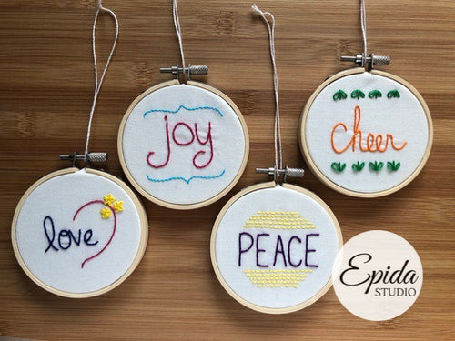 four hand stitched ornaments.