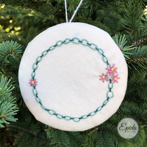 hand embroidered Christmas ornament.