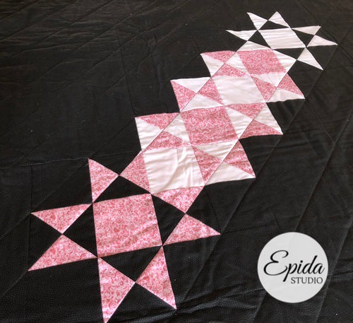 pink Ohio stars on brown fabric.