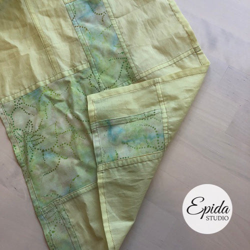 close up of green and yellow scarf.