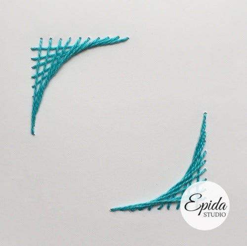 card with embroidered corners.