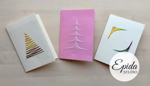 three hand stitched cards.