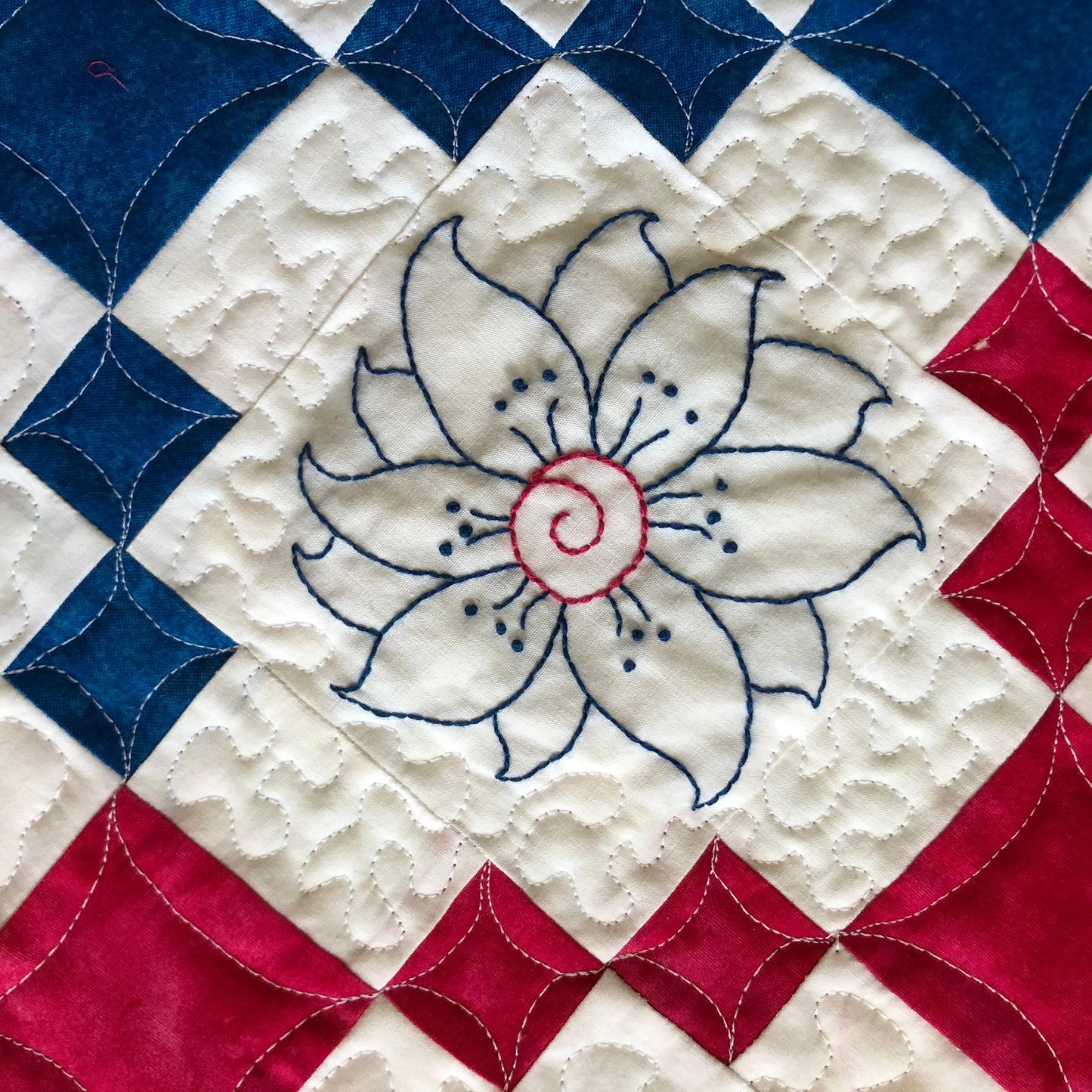 blue embroidered flower.