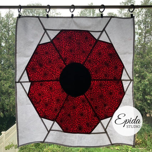 stained glass poppy window hanging.