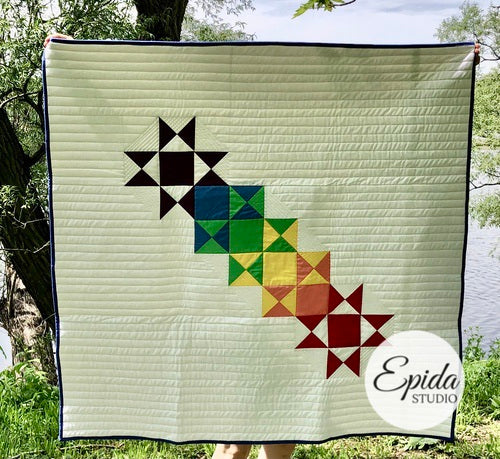 rainbow of Ohio Stars on quilt.