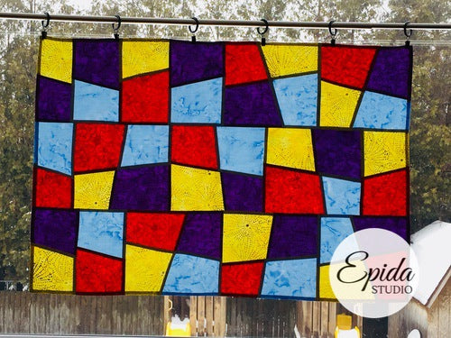 "Checkerboard" pojagi improv window hanging in primary colours.