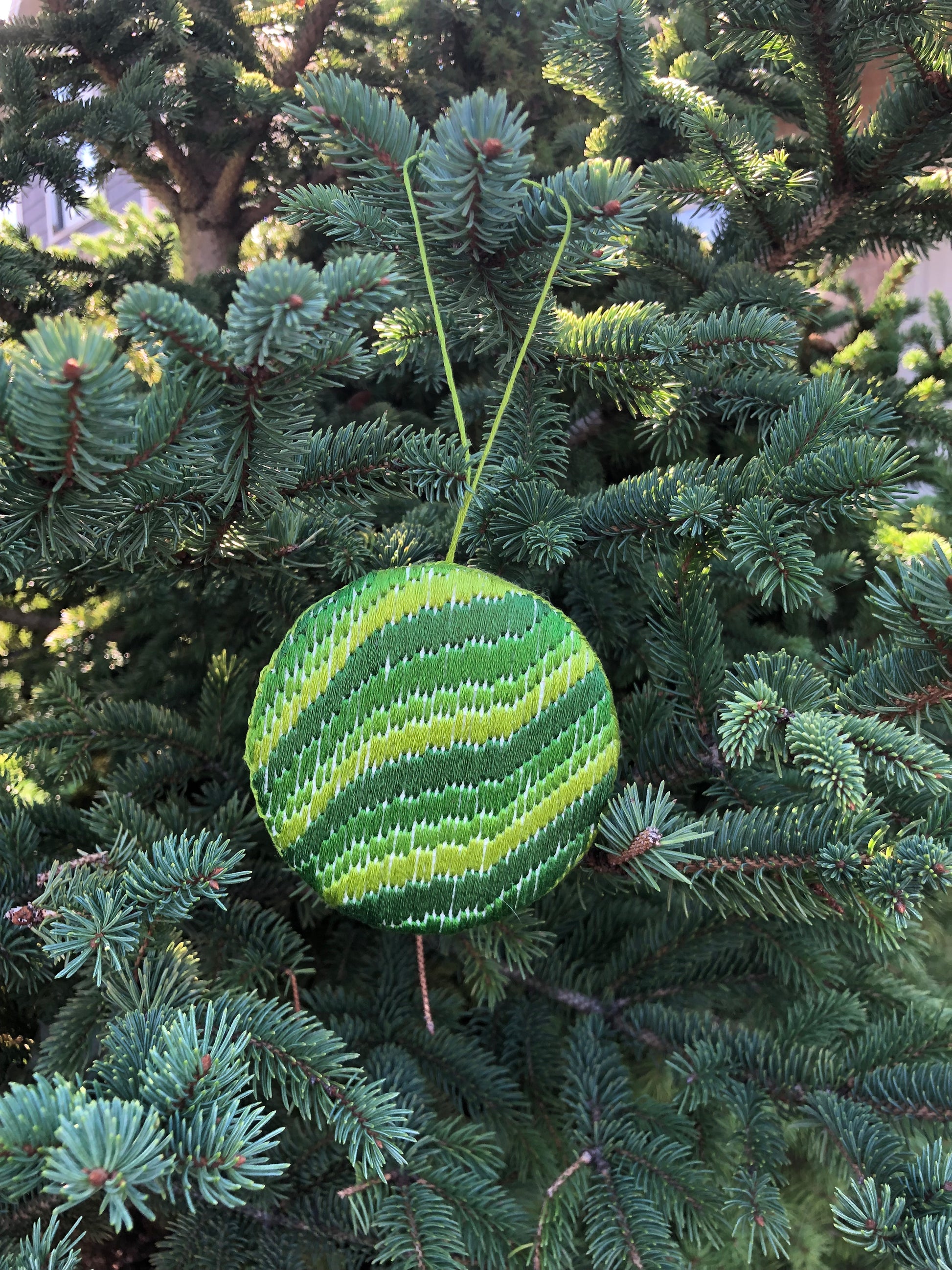 green ornament with bargello embroidery.