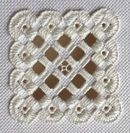 white hardanger stitched motif.