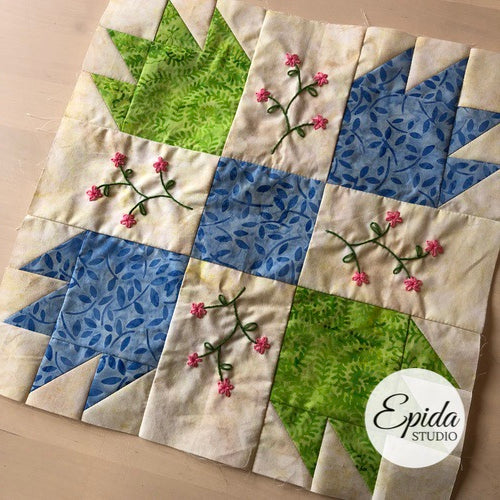 green and blue bear paw quilt block.