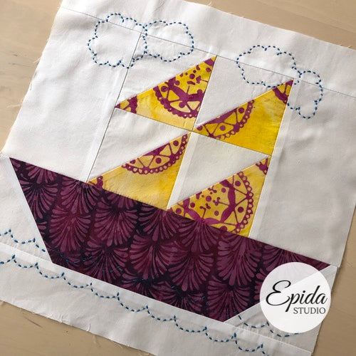 ship quilt block embellished with hand embroidery.