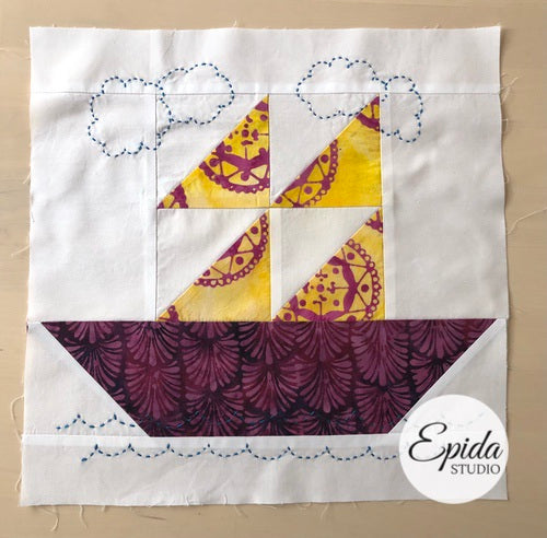 purple and gold ship quilt block.