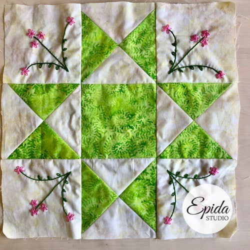 Ohio star quilt block with embroidery.