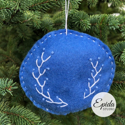 blue ornament with white embroidery.