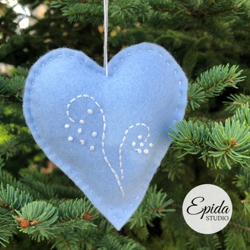 heart-shaped ornament with hand embroidery.