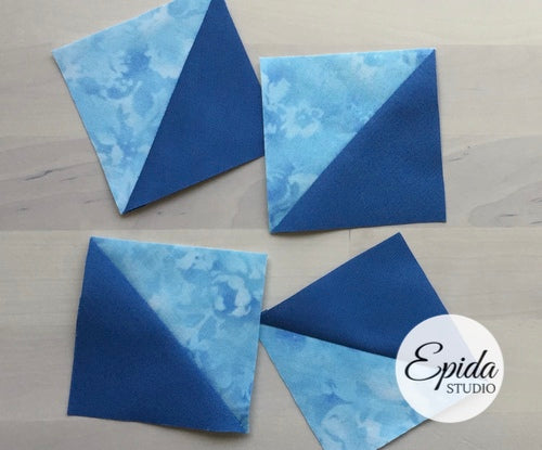 Four blue fabric squares with a diagonal split between solid dark blue and light blue marbled fabric, arranged on a light wood background with an Epida Studio logo in the bottom right corner.