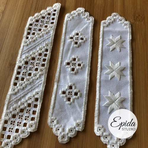 three hand stitched hardanger bookmarks.