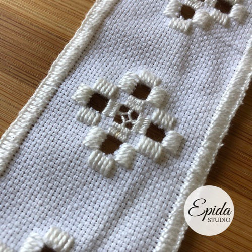 close up of hardanger motif on bookmark.