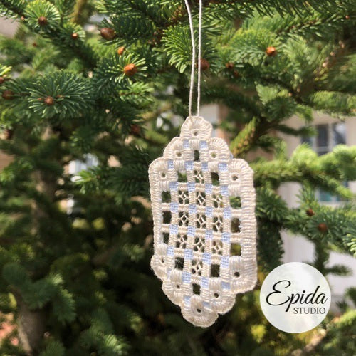 hand stitched ornament in tree.