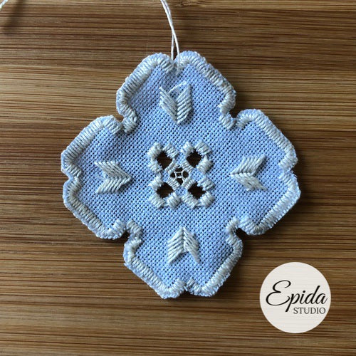 hardanger ornament made with blue linen.