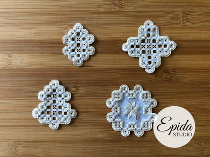 four hardanger embroidery ornaments.