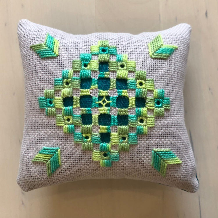 hardanger embroidery finished as a pincushion.