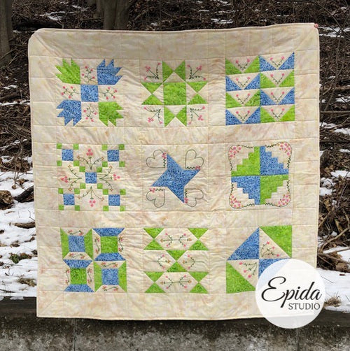 2023 BOM quilt in blue and green.