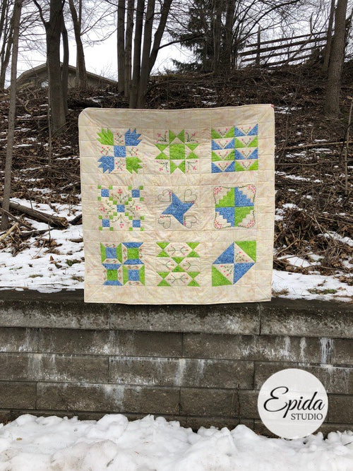 hand embroidered quilt outside.