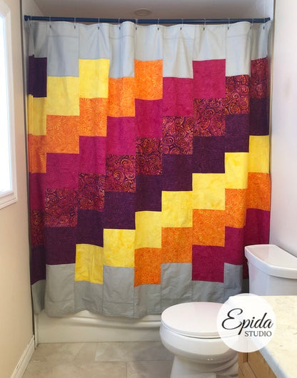 patchwork shower curtain in yellow and purple fabrics.