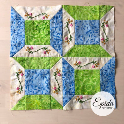 double spool quilt block with embroidery.