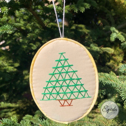 hand-stitched Christmas tree ornament.