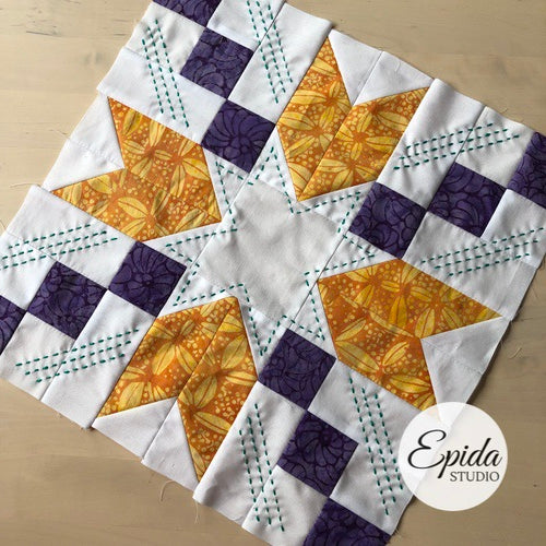 star quilt block with hand embroidery.