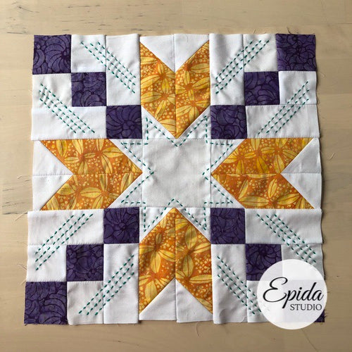 purple and gold star quilt block.