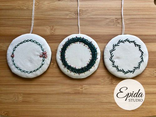 three hand embroidered wreaths.